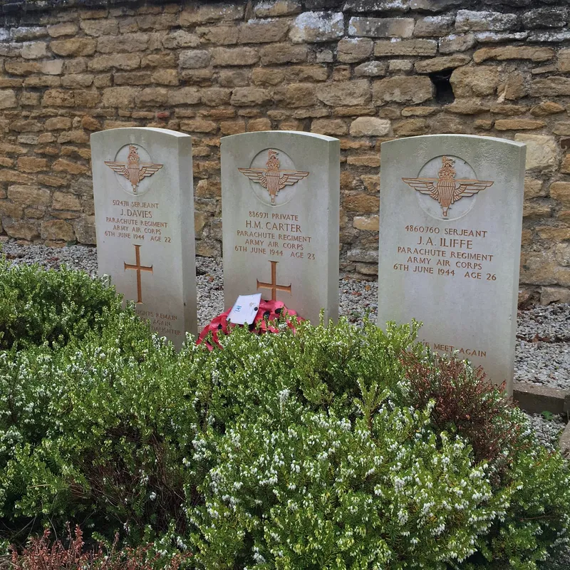 Three Commonwealth War Graves Commission headstones in Troarn cemetery, Normandy